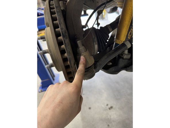 Remove the nuts from the tie rod.