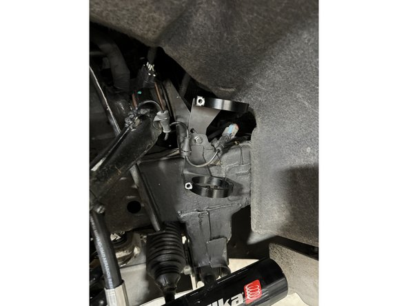 Line up the hole in the bracket with the factory hole in the frame and reinstall the ABS bracket as show in the picture.