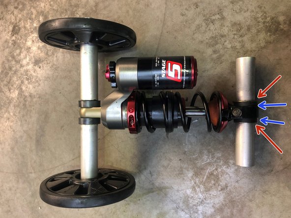 install the oem shaft back on the Elka suspension and make sure you install the oem boushing at the bottom (blue) and the steel  washer (red)