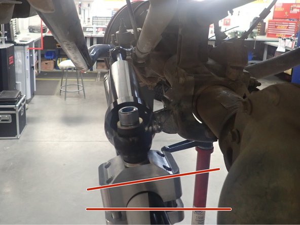 Stick a band of tape next to the right side of the clamp. Slightly tilt the clamp (10-15 degrees) as shown, then mark a line or an arrow as a point of reference.