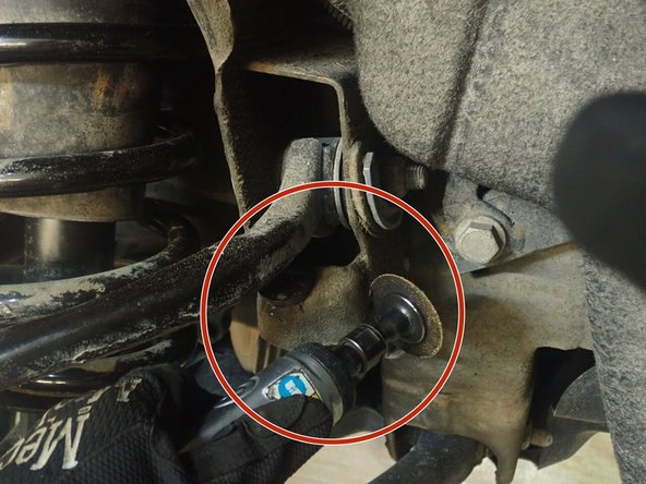 Elka front shocks are longer than oem shocks and may need to cut and remove upper arm stopper as shown to be able to drop lower suspension arm to be able to fit longer shocks.