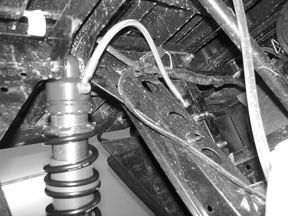 The compression adjustment knobs should be facing the sides of the vehicle for convenient access.