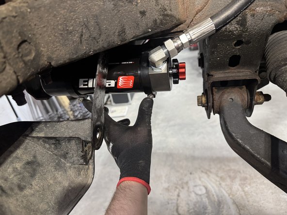 Reinstall the lower pin bolts and torque to 50 Ft-Lb.