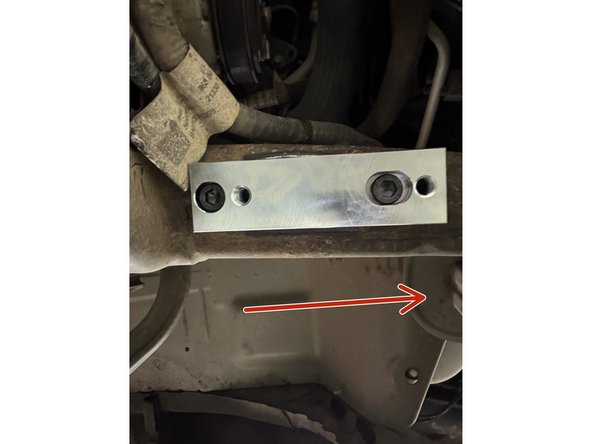 Install the sway bar relocation kit. Make sure the block is installed as shown.  The red arrow is pointing to the front of the truck.