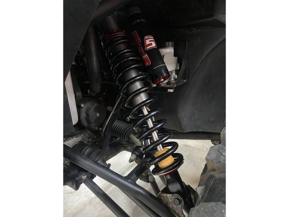 Insert wisdom here.Install the front new Elka shocks with the reservoir ( on Stage 3-4-5 ) left side shown . The reservoir must be orientated backwards