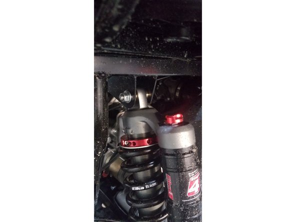 Install the left and right new Elka rear shock with the piggyback reservoir at the top. On Stage 1 and Stage 2, the left and the right shock are the same. Just install them with the shraeder nitrogen valve at the top of vehicle.