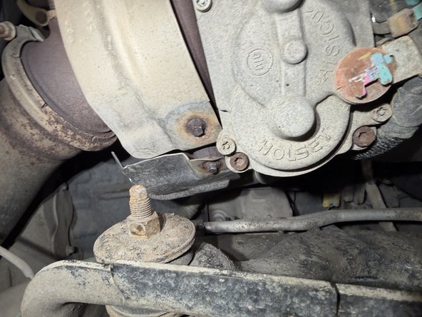 Remove upper nuts and lower bolts, then remove OEM shocks.