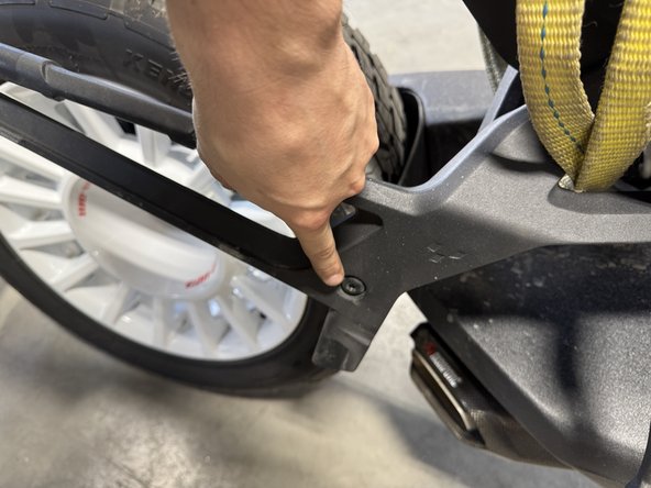 Remove the bolts as shown.