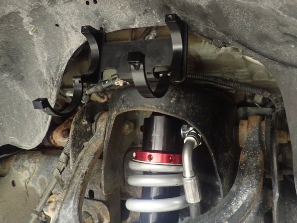 Apply thread locker, then torque the 3 upper bolts to 35 Ft-Lb, and the lower bolts to 210 Ft-Lb.