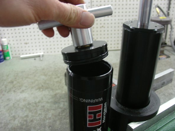 Screw the Elka tool (ASS-TL-0001) on the schrader valve threads and pull the rezzy cap out.