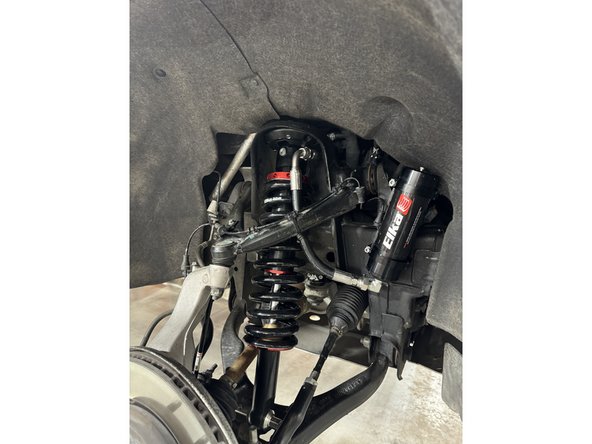 Install the Elka shocks using provided lower bolts and the provided upper bolts. Hoses must face the front of vehicle as shown (right side shown).