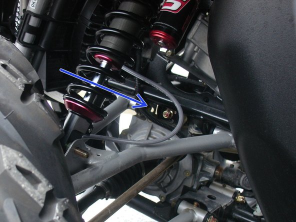 On Stage 2, Stage 4 and Stage 5 models, the lower shock eyelets should be installed with the rebound adjuster oriented towards the rear of the vehicle as shown by the blue Arrow on the photo ( left side shown ). If needed, you can turn the lower eyelet to orient properly.