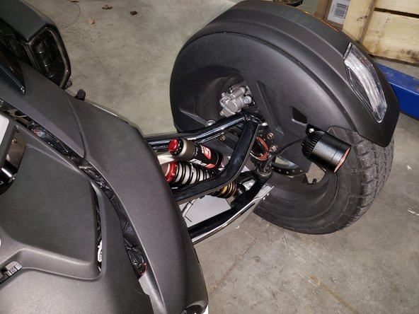 Remove front shock top and bottom bolt using 2x 15mm wrenches for the top and a 15mm ratchet and 15mm wrench on the bottom