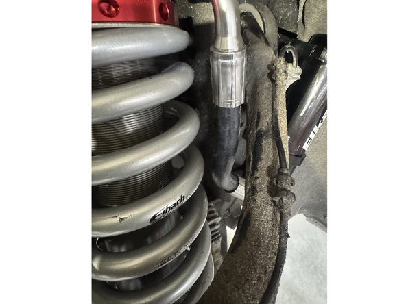 Reinstall the lower pin bolts and torque to 50 Ft-Lb.