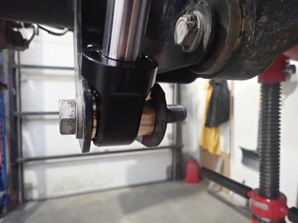 Offset spacers are used to get more clearance between frame and piggyback head. The larger spacers must face inside the vehicle to bring shocks further of the frame as shown. (right side shown)