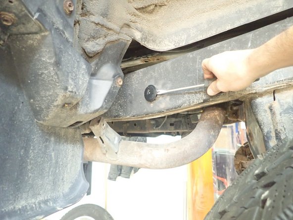 Remove plastic cap located rearward the rear wheels outside and Inside frame.