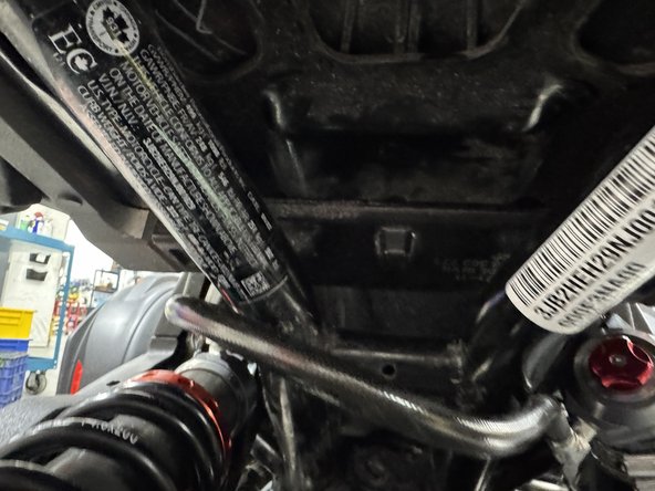 Install the reservoir as shown. Use the provided mounting hardwire.