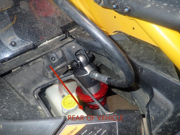 Install rear remote reservoir shocks with the hoses facing the rear of vehicle.