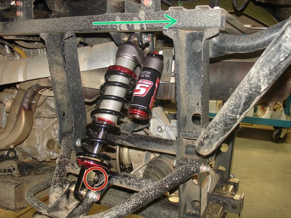 Install both new Elka rear shocks with the piggyback reservoir at the top and oriented towards the rear of the vehicle as indicated by the green Arrow on the photo. (left side shown)