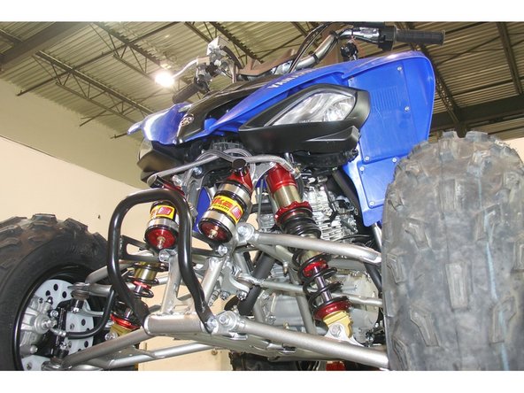 Install the reservoir with the banjo bolt (connected to the reservoir) facing towards the rear of the vehicle.  The reservoir must be attached to the frame using the provided rubber holders and metal collars. Do not over tighten the metal collars on the reservoir (torque to 6 lb/in).  Make sure to route the hose according to the pictures.