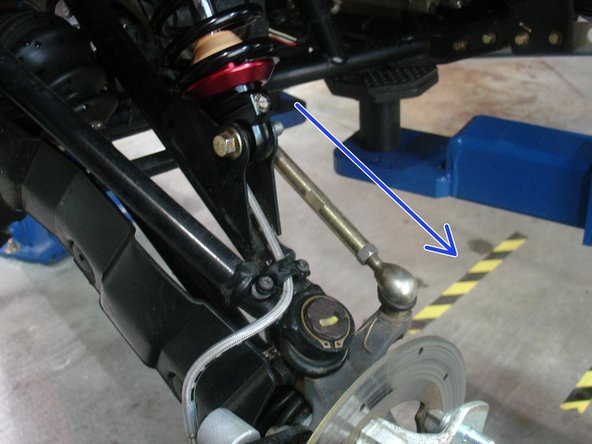On Stage 2, Stage 4 and Stage 5 models, the lower shock eyelets should be installed with the rebound adjuster oriented towards the outside of the vehicle as shown by the blue Arrow on the photo ( left side shown ). If needed, you can turn the lower eyelet to orient properly.
