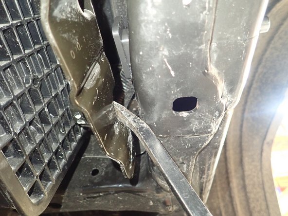 On the right side, to have access to the cap inside of frame, remove the screws of the steel bracket then pry the bracket to have access.