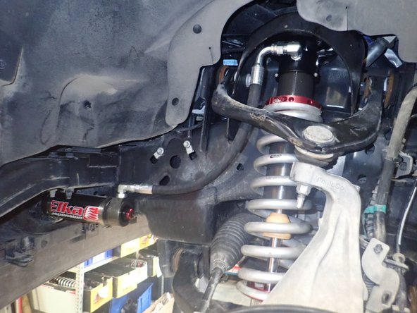 Don't forget to tighten upper and lower arms bolts.