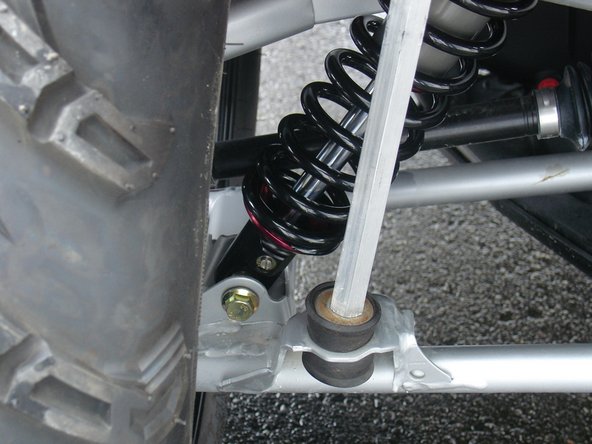 On Stage 2, Stage 4, and Stage 5 models the rebound adjuster located on lower eyelet of the shocks should be oriented towards the rear of the vehicle, as shown. (Left side shown ). If needed, you can turn the lower eyelet to orient properly.