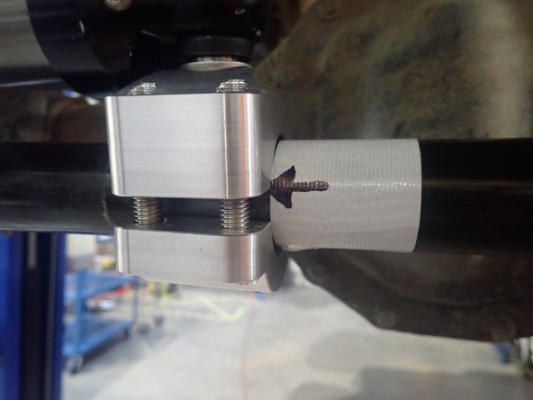 Stick a band of tape next to the right side of the clamp. Slightly tilt the clamp (10-15 degrees) as shown, then mark a line or an arrow as a point of reference.