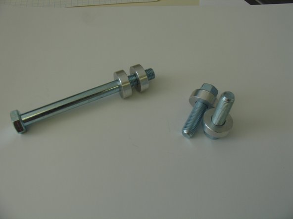 Install the rear elka suspension  with the bolts kit provided as it shown on the picture . The aluminium spacer will allow the space claim of the coil over shock.