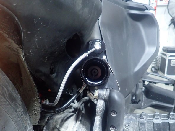 Using supplied rubber mounting kit, attach the reservoir as shown.