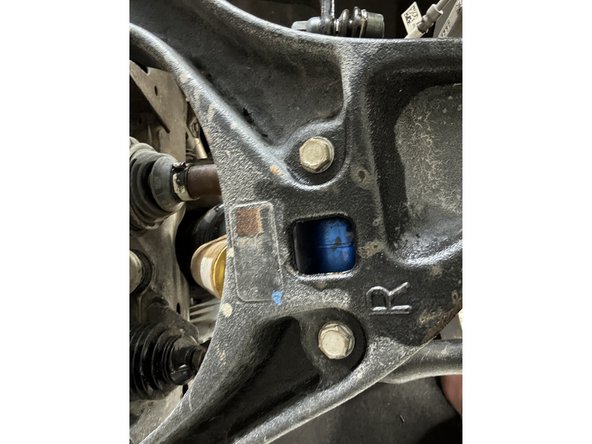 Remove the bolts from the lower shock mounts