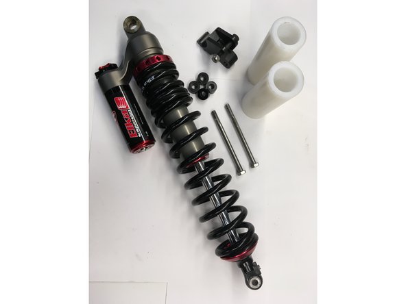 The Kit include:1 linkage, 2 long M8 bolts, 1 M8 shock bolt with lock nut, 4 aluminium spacers and 2 nylon sleeves