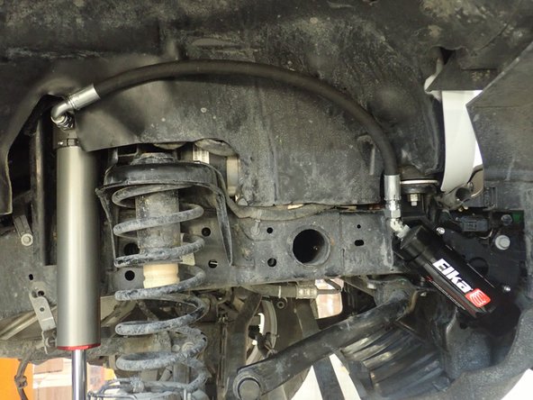 First, install supplied washer on UPPER BOLT as shown by red arrow. ( front and rear).