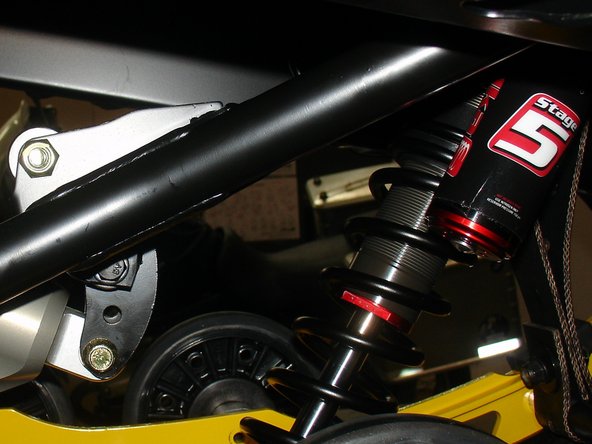 Install the Elka center shock with piggyback reservoir at the top and pointing towards the right side of the snowmobile as show on the photo.