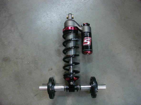 Do not forget to put back inner track rail original washers ( as shown by green Arrow ) when installing center shock