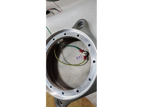 Unbolt the connector and last two cables attached to the base.