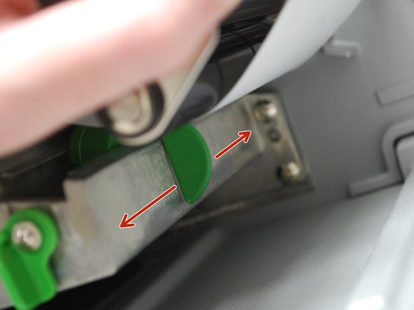 After unlocking the lever, use the green tab (second picture) underneath the damper roller to adjust the media sensor.