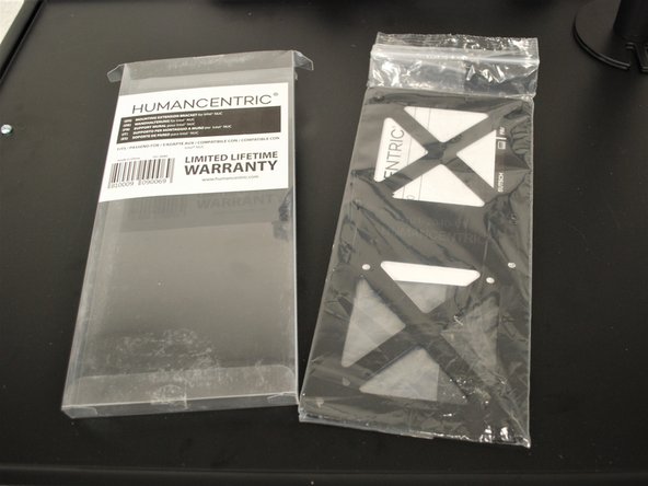 Remove the provided monitor from the packaging.