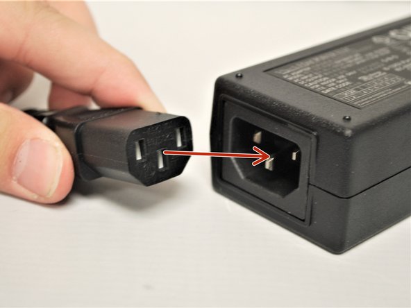 The Power Outlet Plug and the AC Adaptor Plug are two ends of the same cable.