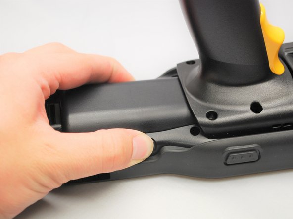 Find the Battery Release Buttons on the left and right of the Mobile Computer.