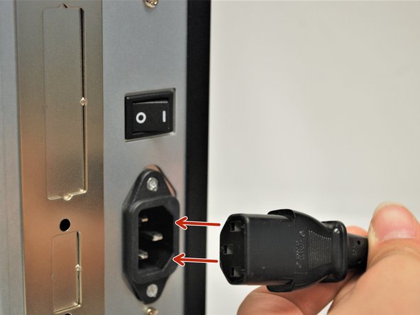 Connect the Printer Power Cord into the back of the printer in the power cord socket.