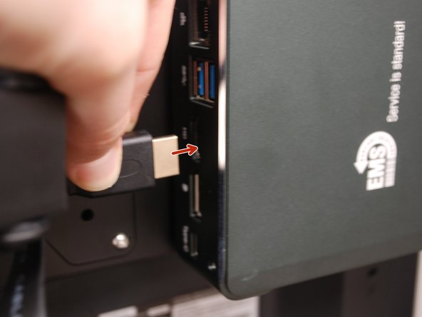Plug one end of the HDMI cable into the Mini PC