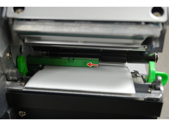 The arrow on the media sensor (3rd picture) should be approximately centered on the label. The arrow marking indicates the position of the sensor the printer uses to calibrate, so it's important to make sure it's in the right place.