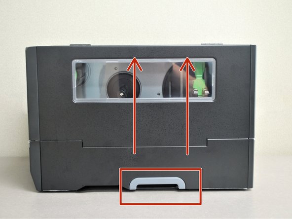 Grab the bottom of the cover and lift all the way open, until it's resting on the top of the printer.