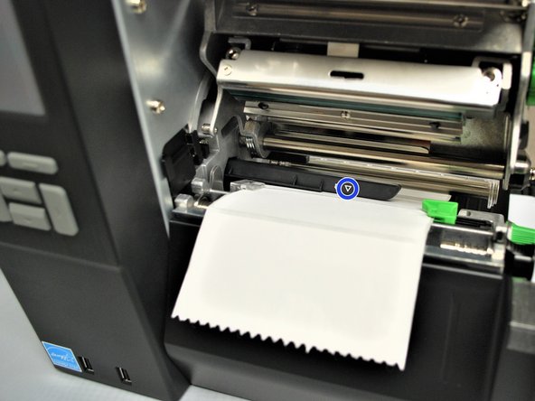 The gap sensor (shown as ▽) on the ribbon sensor (shown with a blue circle in the 2nd picture) should be approximately centered on the label.