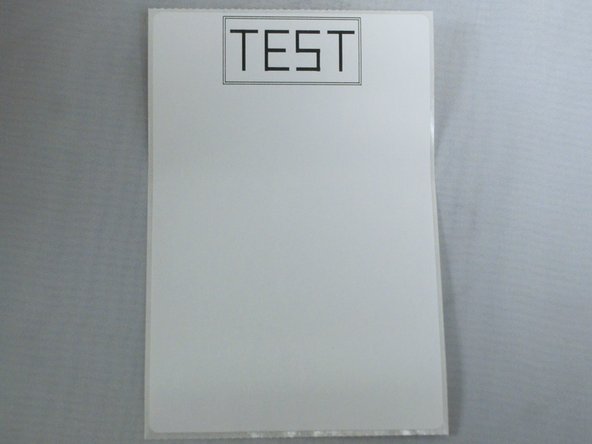 The printer should now print a test label, with the word &quot;TEST&quot; printed in a large box (example shown).