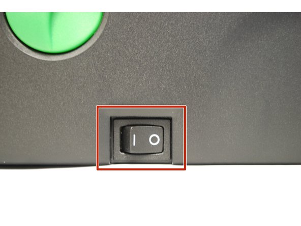 Take the plastic film off of the printer, and get the cables out of their packaging.