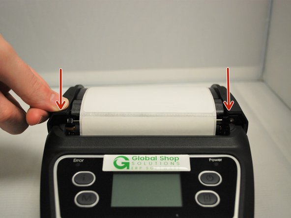 Close the lid, pressing down firmly on both sides to make sure the lid shuts all the way.