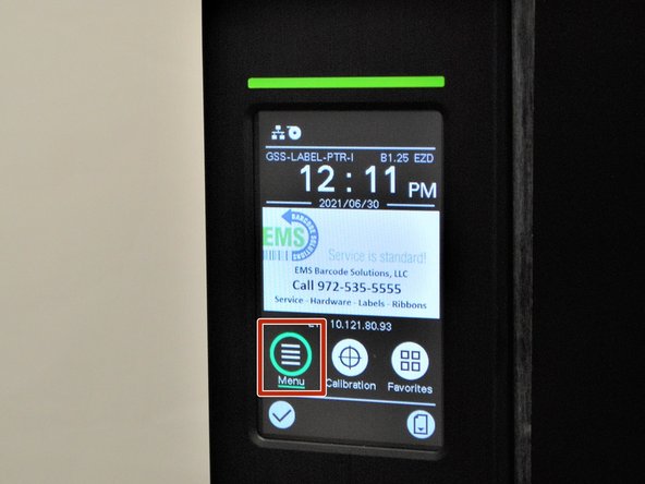 Tap or select the 'Menu' option on the printer screen.